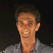 Stazione Centrale, Roma. They're stopped in front of me. A young American  couple, Tevas