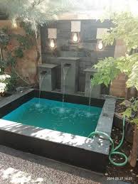 Selain taman, kolam ikan juga merupakan dekorasi yang sangat lihai mempercantik dan menghidupkan suasana rumah. Jasa Tukang Taman Magetan Kolam Minimalis Tebing Dekorasi Taman Cipta Alam