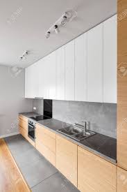 Kitchen furniture for small kitchen. Contemporary Kitchen Furniture With Long Grey Countertop And Modern Kitchenware Stock Photo Picture And Royalty Free Image Image 74956666