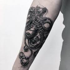 Dragonfly tattoo with fancy artwork on ankle ideas for women. Arm Forearm Dragon Tattoo Designs Pic Rush