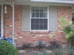 This subtle neutral tone with a bit of coolness to it (thanks to the gray undertones) will break up all the red and orange tones going on in the brick and the redwood. Benjamin Moore Briarwood Trim Stain For Windows On A Red Brick Shutters Exterior Exterior Brick House Color Schemes
