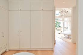 Walk In Closet With Floor To Ceiling Wardrobe Cabinets Cottage Closet Floor To Ceiling Wardrobes Cottage Homes Coastal Cottage