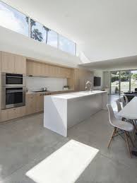 Photo 11 Of 15 In A Cramped Midcentury Bungalow Gets A Luminous New Concrete Kitchen Floor Kitchen Flooring New Kitchen Cabinets