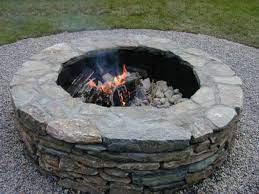 Build a fire pit with concrete block, capstones, and mortar. How To Build A Fire Pit Diy Fire Pit How Tos Diy