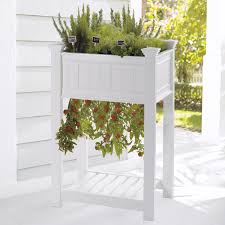 Two different sizes of cedar planters with trellises. Raised Upside Down Tomato Planter And Herb Garden