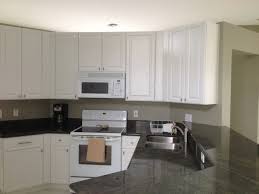 The design adds storage and style with a wall mounted bathroom cabinet. Paula And Frank S Kitchen Reface White Thermofoil With Wood Grain Contemporary Kitchen Miami By Custom Edge Llc Houzz