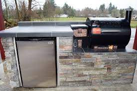 Are you looking for a pellet grill that can be easily loaded into the truck for tailgating events? Outdoor Kitchen For The Traeger Pellet Grill Modular Outdoor Kitchens Outdoor Kitchen Countertops Outdoor Kitchen Grill