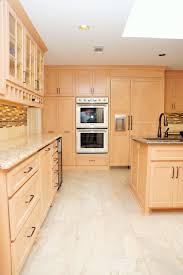 Light Maple Cabinets Stainless Steel Appliances Tan And Brown Tile Back Splash Kitch Light Wood Cabinets Maple Kitchen Cabinets Kitchen Cabinets Pictures