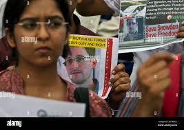 Indian protestors show their support for NSA leaker Edward Snowden at India  Gate in New Delhi, India, Sunday, July 7, 2013. Snowden has found  supporters in Latin America, including three countries who