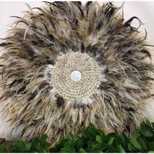 Often customers come into the store and fall in love with our feather wall hangings, but don't know the story behind them. 40cm Round Feather And Shell Wall Art Multi Tone Dianna Lynn Decor