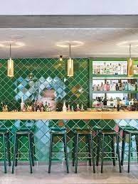 Glazed Ceramic Tiles A Wall In The Cafe Of Krampulz Meyer Architekten S Kitz The Green Is A C Interior Design Southwestern Interior Design Restaurant Interior