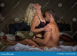 Man kissing womans breasts stock image. Image of bedroom - 79308369