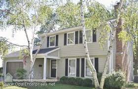 Check spelling or type a new query. Monterey Taupe Siding With White Trim Black Shutters Gray Roof In St Charles Traditional Exterior Chicago By Opal Enterprises Inc Houzz