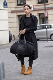Women S Black Coat Black Long Sleeve T Shirt Black Leather Skinny Pants Tan Suede Lace Up Flat Boots Timberland Outfits Women Timberland Boots Women Outfit Fashion