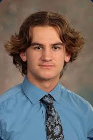 Football players commit to playing collegiately