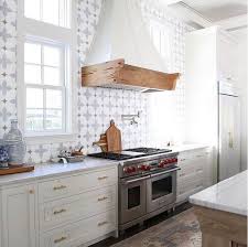 White Kitchen With Pecky Cypress Cabinets Painted In Benjamin Moore Oc 17 White Dove Counte Unique Kitchen Backsplash Interior Design Kitchen Kitchen Interior