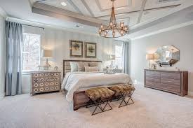 The shiplap application keeps the design grounded in simplicity, while a crystal chandelier adds a hint of fancifulness to the room. Stylish Trends For Your Master Bedroom Eastwood Homes