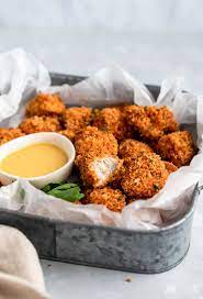 The Best Crispy Baked Chicken Nuggets Ambitious Kitchen Recipe Baked Chicken Nuggets Healthy Baked Chicken Crispy Baked Chicken