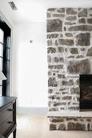 How To Diy Over Grouted Stone Fireplace For Under 200 Chris Loves Julia In 2020 Diy Stone Fireplace Whitewash Stone Fireplace Painted Stone Fireplace