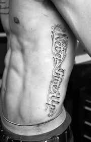 60 Never Give Up Tattoos For Men Phrase Design Ideas Rib Tattoos For Guys Tattoos For Guys Rib Tattoo