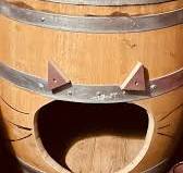 Lovely cat house made from painted old barrels .. 🐈🌺💚