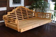 A dining table poolside is ideal for a relaxing eating experience, especially with tiki torches providing an ambient glow. 7 Wood Daybed Ideas Furniture Wood Daybed Pallet Furniture