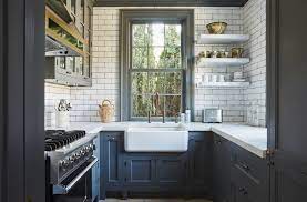 The Same House Features A Small Kitchen With Units Fitted To Be As Ergonomic As Possible Two Large Win Bungalow Kitchen Interior Design Kitchen Kitchen Design
