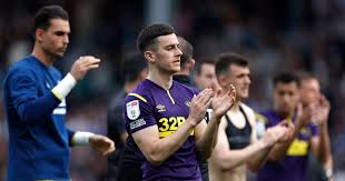 Derby County's Tom Lawrence applauds the fans after defeat against Queens  Park Rangers at the Kiyan Prince Foundation Stadium, London, April 2022.