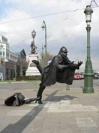 Amazing Balance In This Statue Man Manhole Caped Man Foot Caught Statue Art Sculpture Art Street Art Public Art