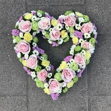 Unique white and green clustered open heart funeral flowers tribute. Open Rose Heart Buy Online Or Call 01474 355007