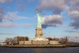 When the statue was dedicated in 1886, two rows of portholes had been cut from the copper at the bottom of the torch to illuminate it from inside. Guide To Visiting The Statue Of Liberty And Ellis Island Luxe Adventure Traveler