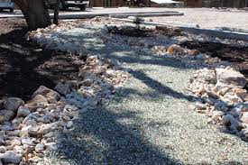 You may wish to give the pile a bit of a rinse to get toss any stray stones back to their spot. How To Keep Gravel In Place On Driveways And Walkways Truegrid Pavers