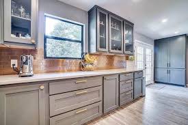Warm copper adds a sense of luxury to this kitchen. Metal Kitchen Backsplash Ideas Designing Idea