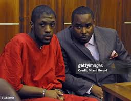 Venjah Hunte, left, with his new lawyer, Reginald Mathis, looks