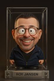 Prompt: Transform the person from the attached photo into a scene where he  is sitting