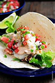 Fish tacos, that great meal of the baja peninsula, and a taste of summer they are simple to make, no more complicated in fact than a hamburger or a mess of pancakes, and they are considerably more flavorful fried in strips and served onboard warm corn tortillas with a simple salsa, a pinch of fresh cabbage, plenty of lime and a cream sauce you might want to punch up with some chopped chipotle. Fish Tacos Recipe Cooking Add A Pinch Delicious Seafood Recipes Fish Tacos Recipe Recipes
