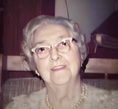 Is it odd for a young lady to have a professional portrait taken with a  bare shoulder in 1915 in New York City?