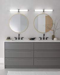 The white bathroom vanity is equipped with a vessel sink, powder room makeup area and wall sconce lighting. 220 Bathroom Lighting Ideas In 2021 Bathroom Lighting Vanity Lighting Great Bathrooms