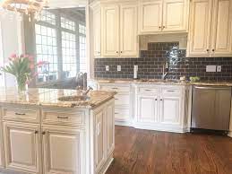 Glazed Cream Cabinets With Dark Backsplash Cheap Kitchen Cabinets Cheap Kitchen Modern Backsplash