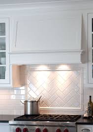 Range Hood By Mullet Cabinet In Millersburg Ohio Kitchen Backsplash Designs Kitchen Tiles Backsplash White Kitchen Backsplash