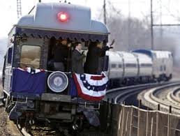 Barack Obama boards train to Washington