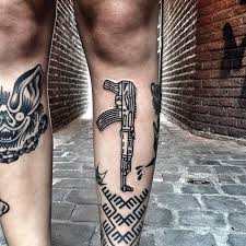 ak 47 and ornament tattoo on the leg tattoogrid net ak 47 and ornament tattoo on the leg
