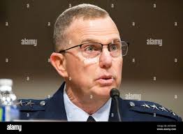 Air Force District of Washington Commander Maj. Gen. Darryl Burke (right)  greets Secretary of the Air Force Deborah Lee James as she arrives at Joint  Base Andrews, Md., for a farewell ceremony