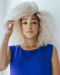Smooth the coconut oil through your hair, applying only from the ears down, paying special attention to the ends. The Secret To These Perfect Curls Is Coconut Oil And Daily Washes