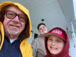 Even in the pouring rain, my grandson's Bryson and Carson trudged  door-to-door with me asking for votes. When the rain was too much we got  rescued by this kind lady, Belinda Bratcher