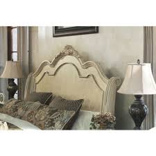 With the beauty of the opulent antique white finish perfectly enhancing the intricate moulded ornamentation scrolling throughout these tables along with the natural inlayed marble inset on the cocktail table, the ortanique accent table collection captures the elegance of old world design to create a warm inviting environment for any living area. Ortanique Sleigh Headboard Bedroom Set In Light Opulent