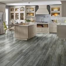 Laminate also comes in a variety of colors. Smartcore Pro Covington Oak 7 08 In X 48 03 In Waterproof Interlocking Luxury Vinyl Plank Flooring 16 54 Sq Ft Lowes Com Luxury Vinyl Plank Flooring Luxury Vinyl Plank Vinyl Plank Flooring