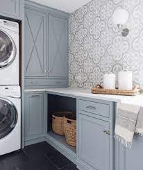 Laundry room with bold blue cabinetry and wood tile in a herringbone pattern. All About The Blues My Top Blue Choices For Laundry Rooms Jettset Farmhouse