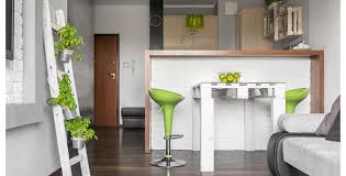 Super smooth surfaces run from walls to cabinets to countertops and the texture even flows to the clear plastic stool tops. Kitchen Design With Pantone S Color Of The Year 2017 Greenery