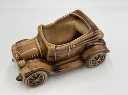 Image result for Pottery Brown 1931 Oldsmobile